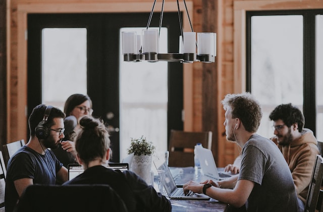 a group of people chatting at a table