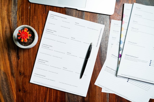 documents on brown table