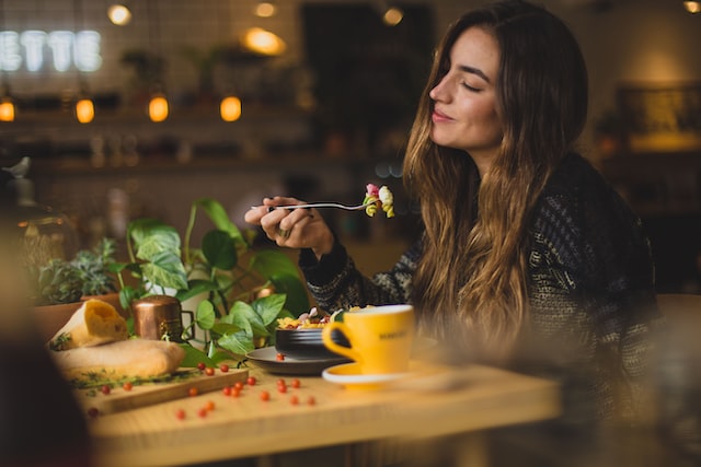 girl enjoying dinner in a restaurant