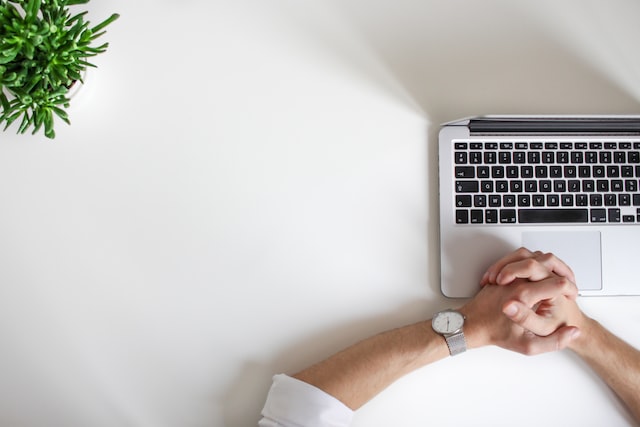 man sitting at laptop