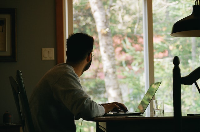 man working on laptop at home