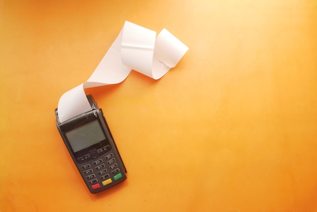 payment machine on orange background