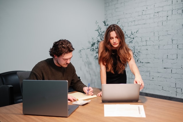 two workers in one room