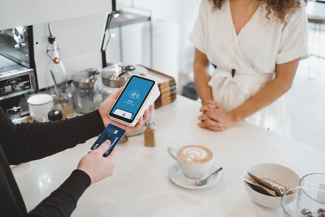 person pay by card